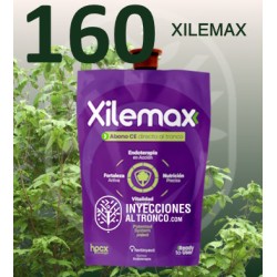 Xilemax Ynject sobre fondo verde, fertilizante para árboles.